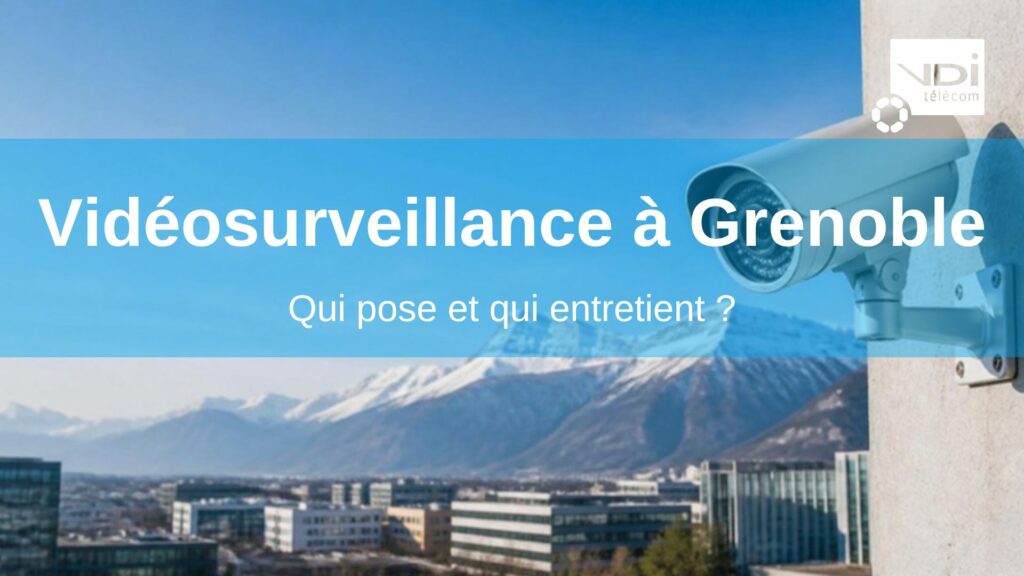 Caméra de vidéosurveillance professionnelle devant l'agglomération de Grenoble et les montagnes enneigées